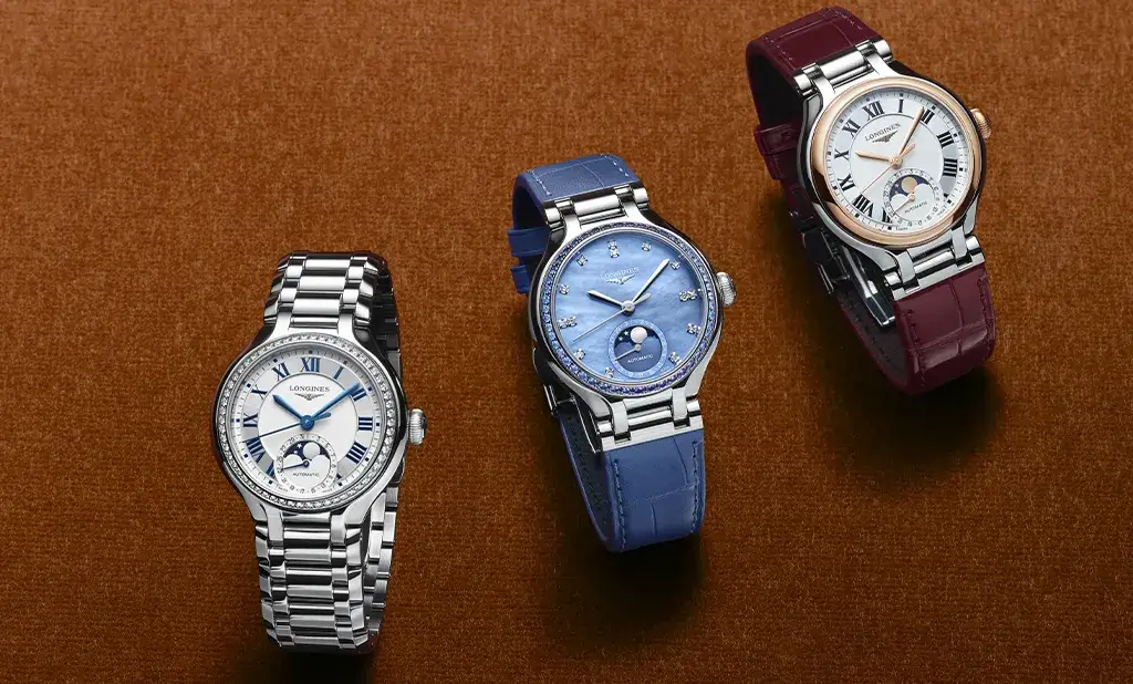 Tři dámské hodinky Longines PrimaLuna Moonphase – na ocelovém náramku, s modrým a vínovým řemínkem z aligátoří kůže