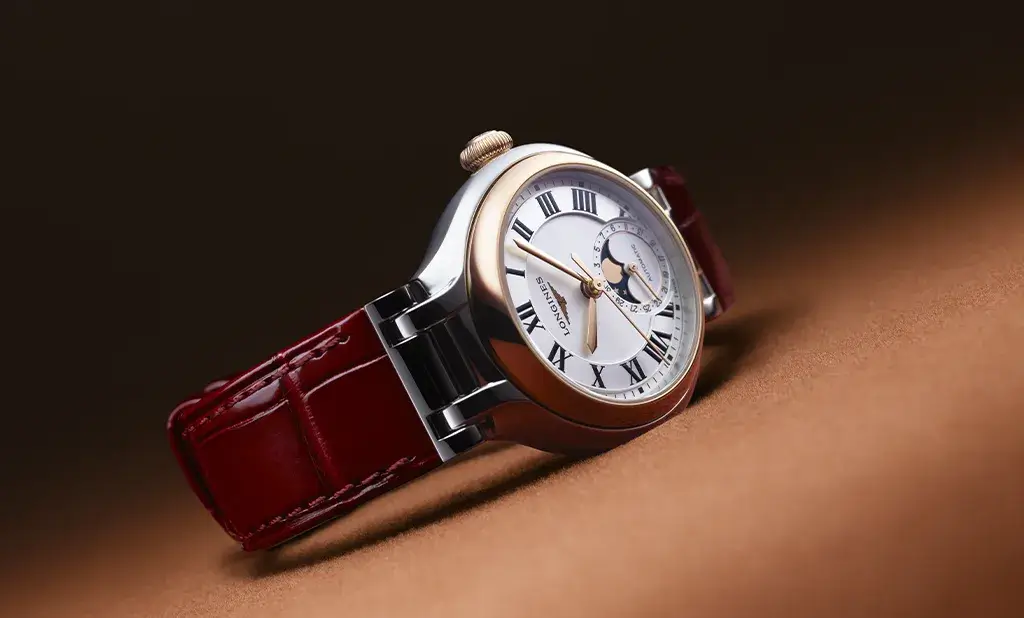 Dámské hodinky Longines PrimaLuna s pouzdrem v barvě růžového zlata a červeným řemínkem z aligátoří kůže